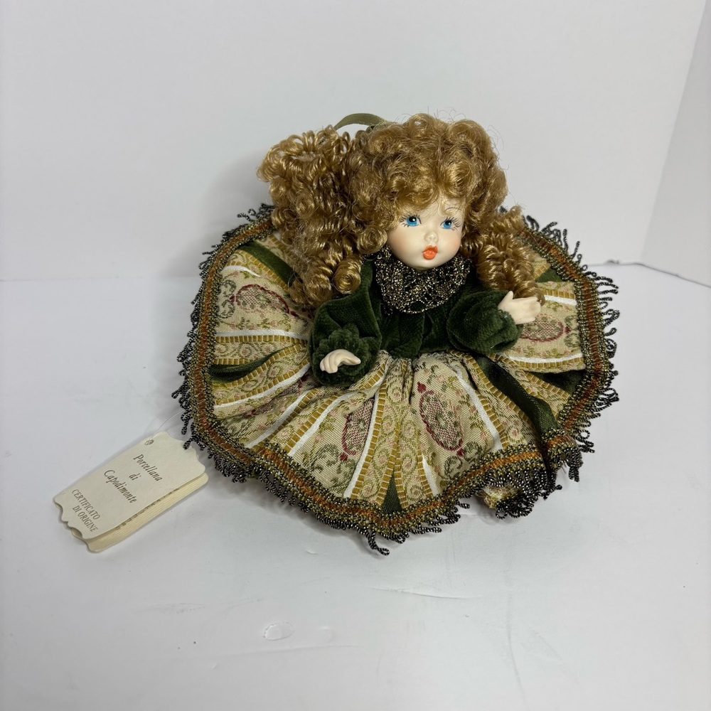 Elegant Green and Gold Porcelain Doll